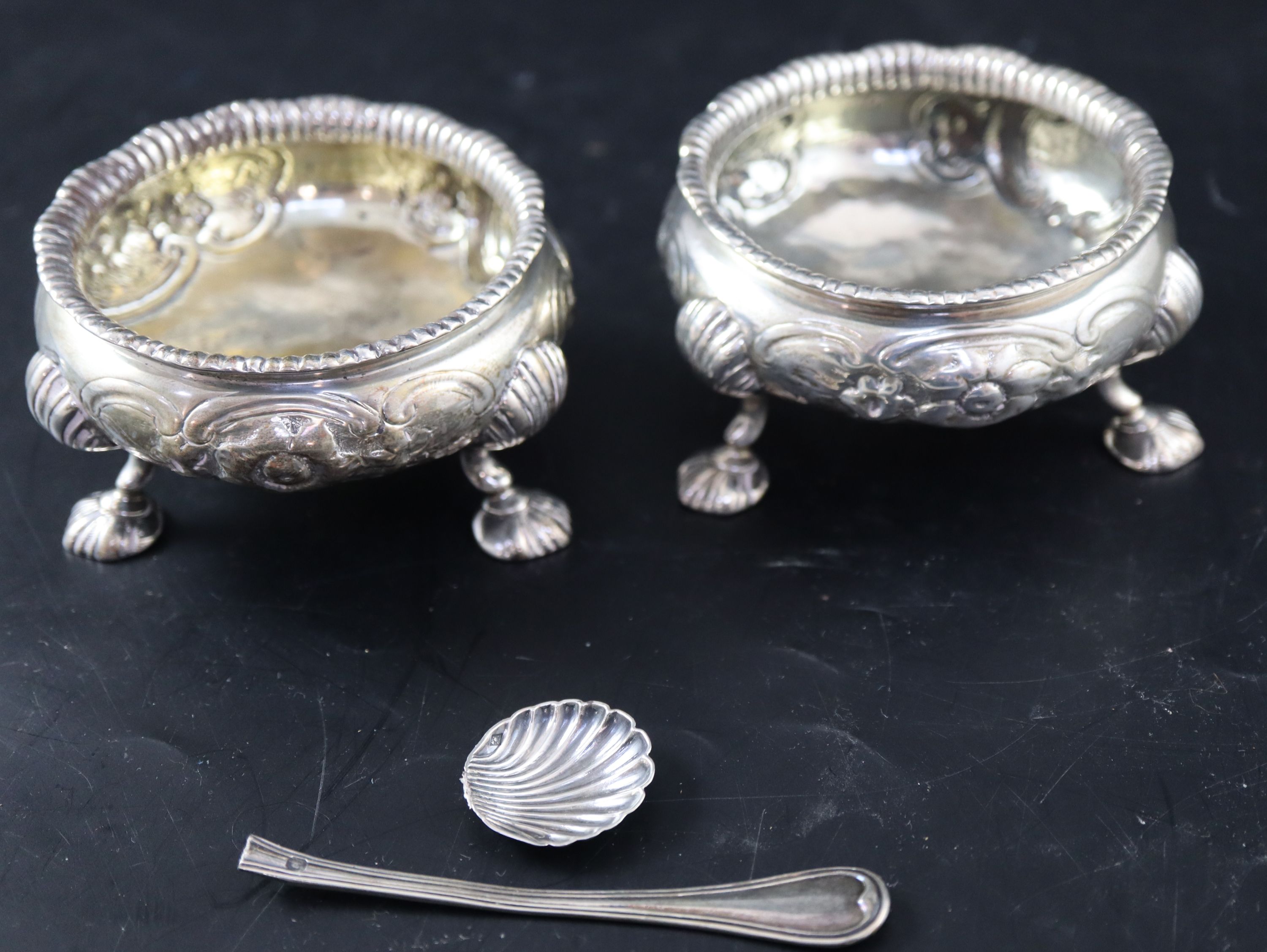 A pair of Victorian embossed silver bun salts, 8.5oz.